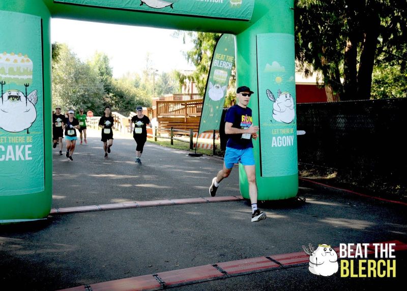 Blog author crossing the finish arch