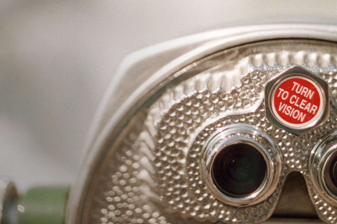 Pier binoculars with a knob that reads Turn to Clear Vision, slightly askew.