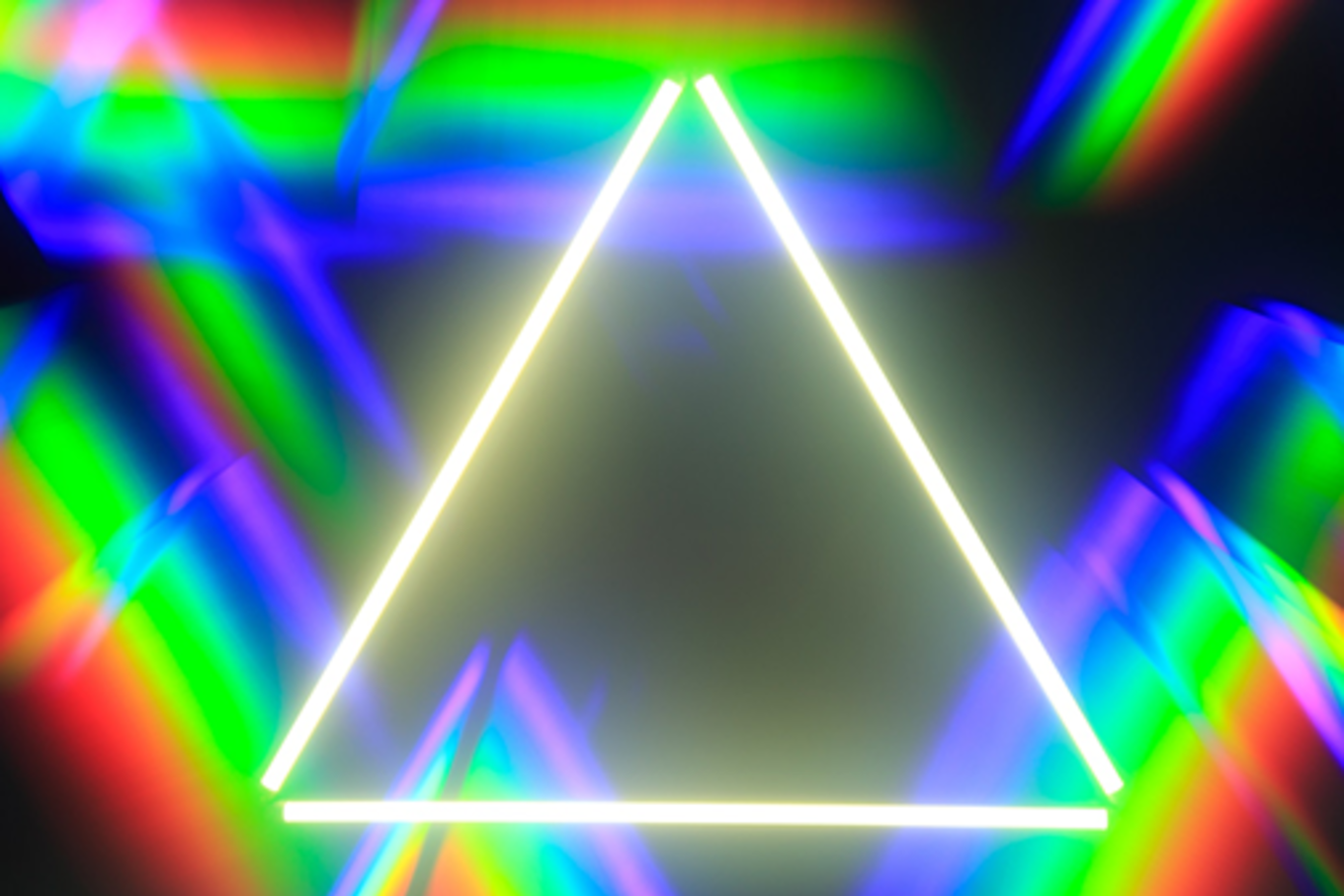 An incomplete triangle made of light that is hovering over a kaleidoscope looking background.