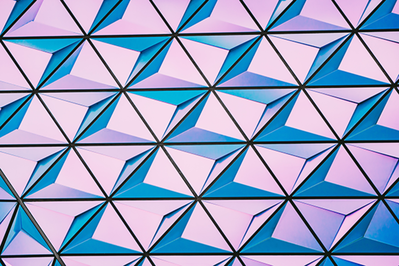 Triangle patterns of pink and blue arranged in an abstract manner.