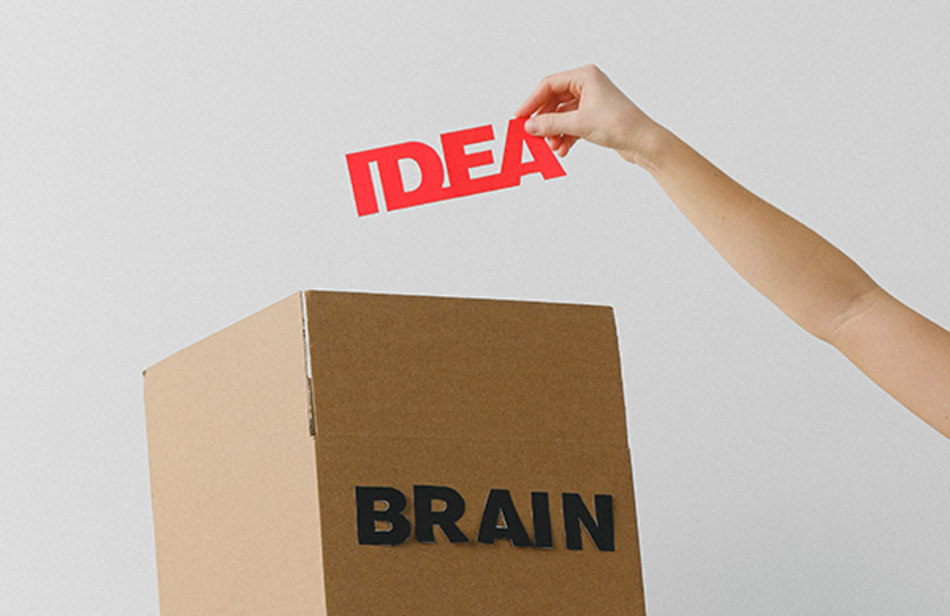 Red letters that spell "idea," are placed into a box marked, "brain."