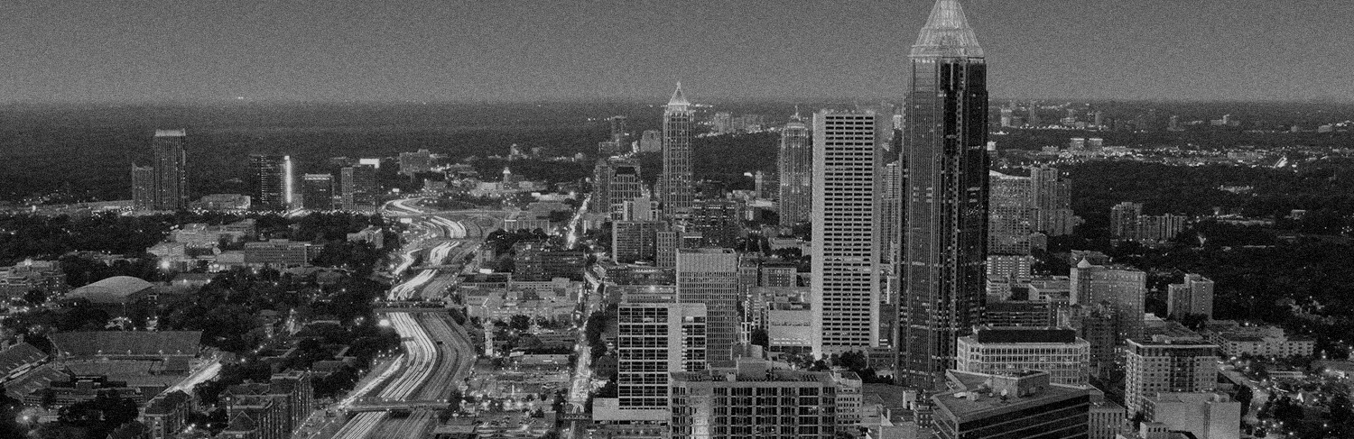 black and white panorama of buildings and highway in Atlanta, GA