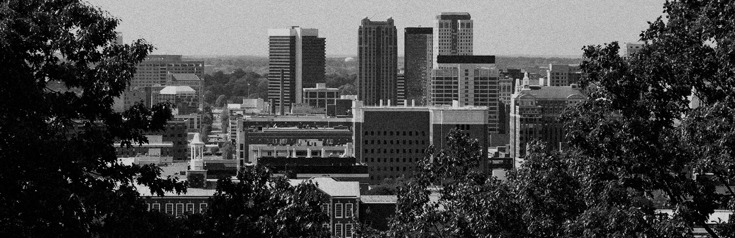 black and white panorama of buildings and trees in Birmginham, AL