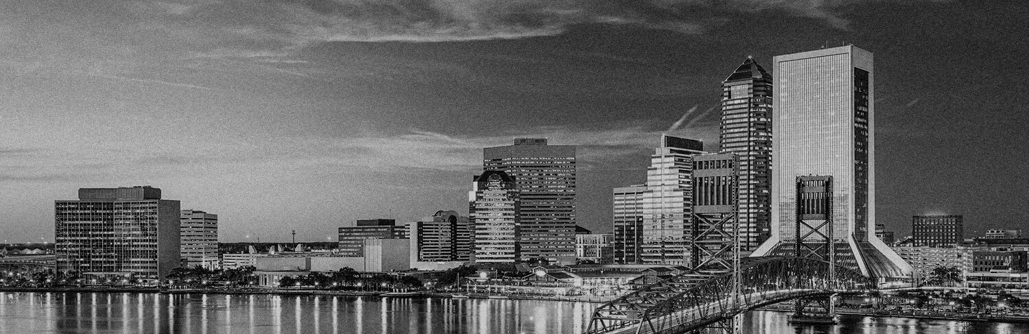 black and white panorama of buildings and waterfront in Jacksonville, FL