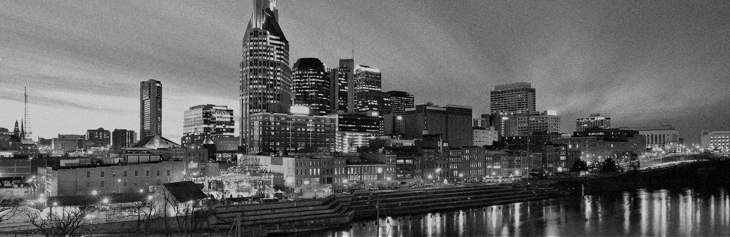 black and white panorama of waterfront and buildings in Nashville, TN