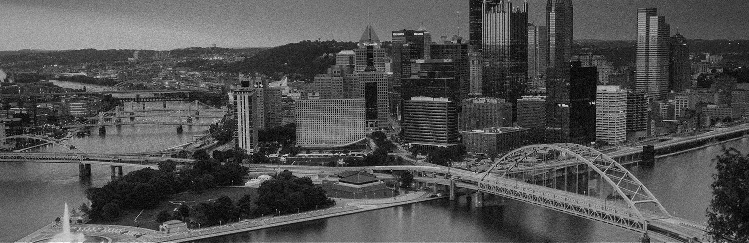 black and white panorama of buildings, bridges and rivers in Pittsburgh, PA