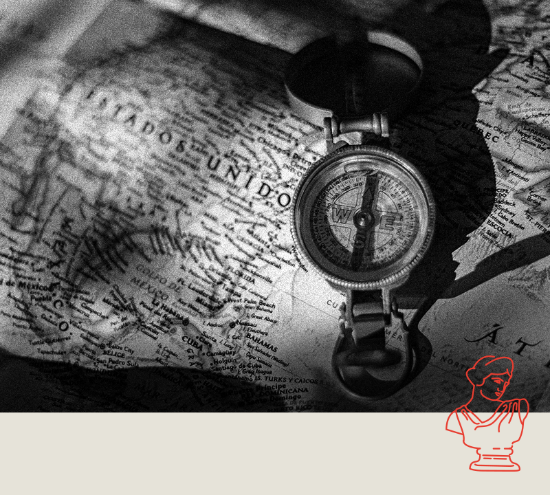 black and white photo of a united states map and a compass