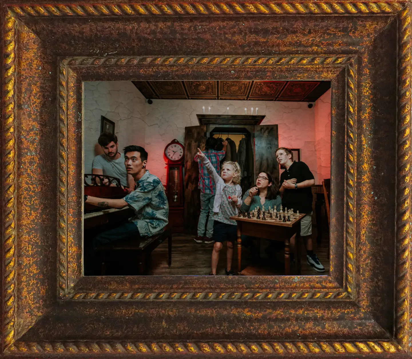 A group of players solving puzzles inside the Mystery Mansion escape room