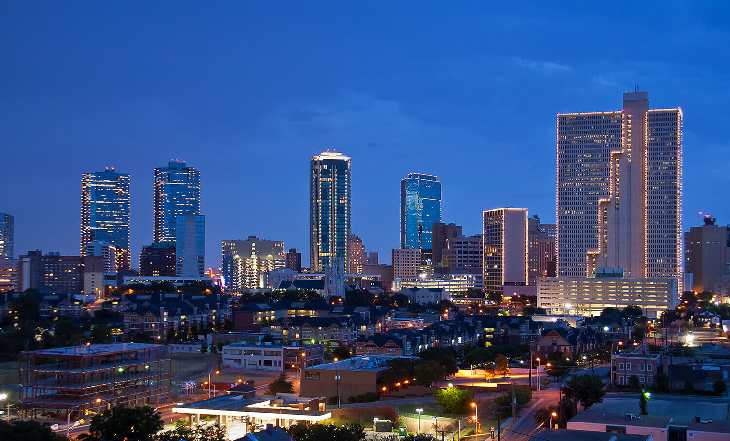 black and white panorama of buildings in Dallas, TX at night