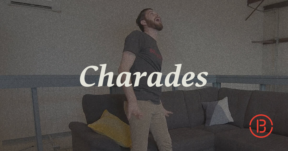 Video still of man acting out a charade