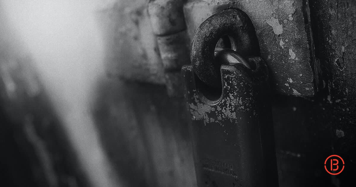 close-up photo of a padlock on a latch