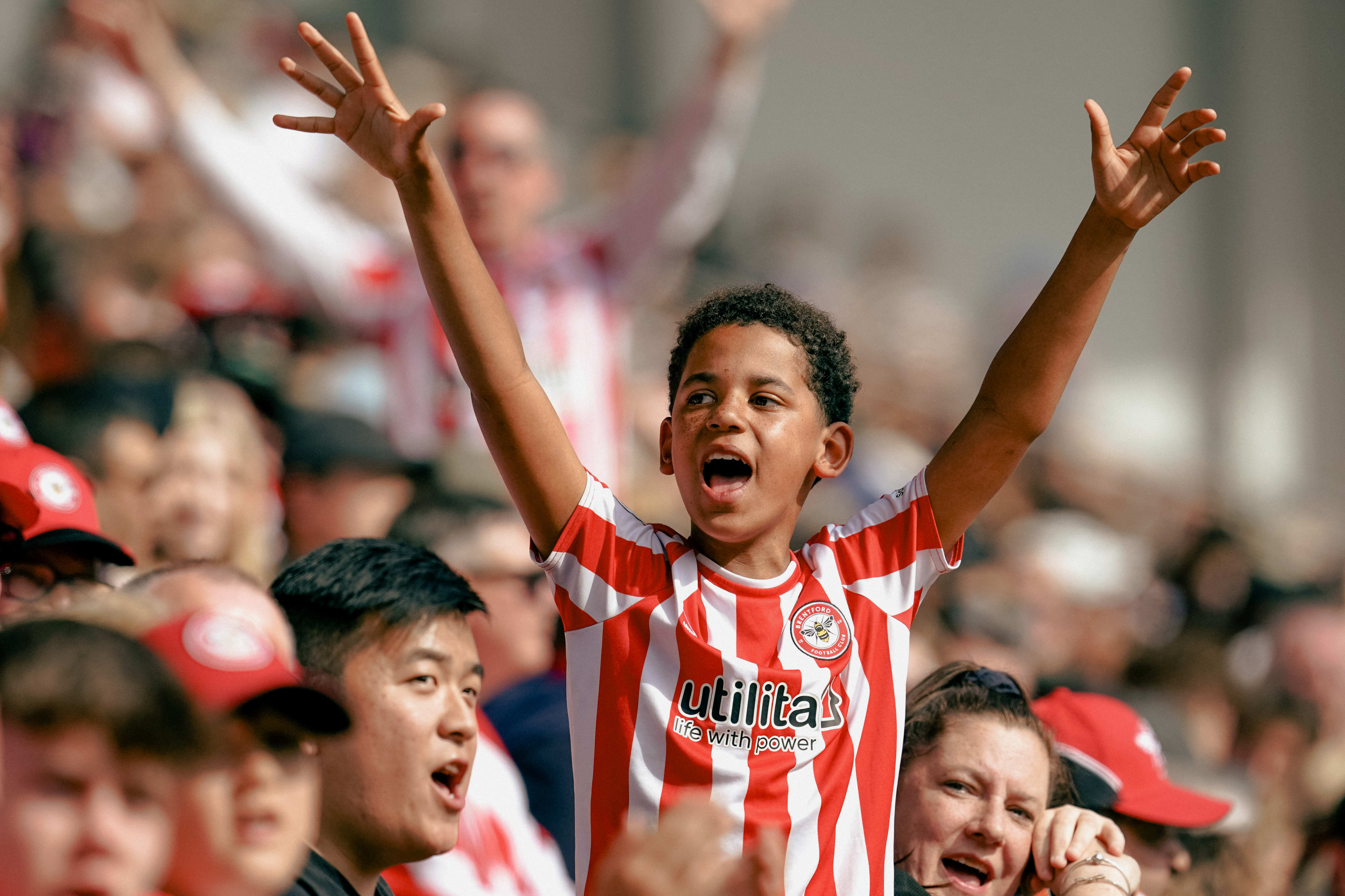 Small child with his hands up