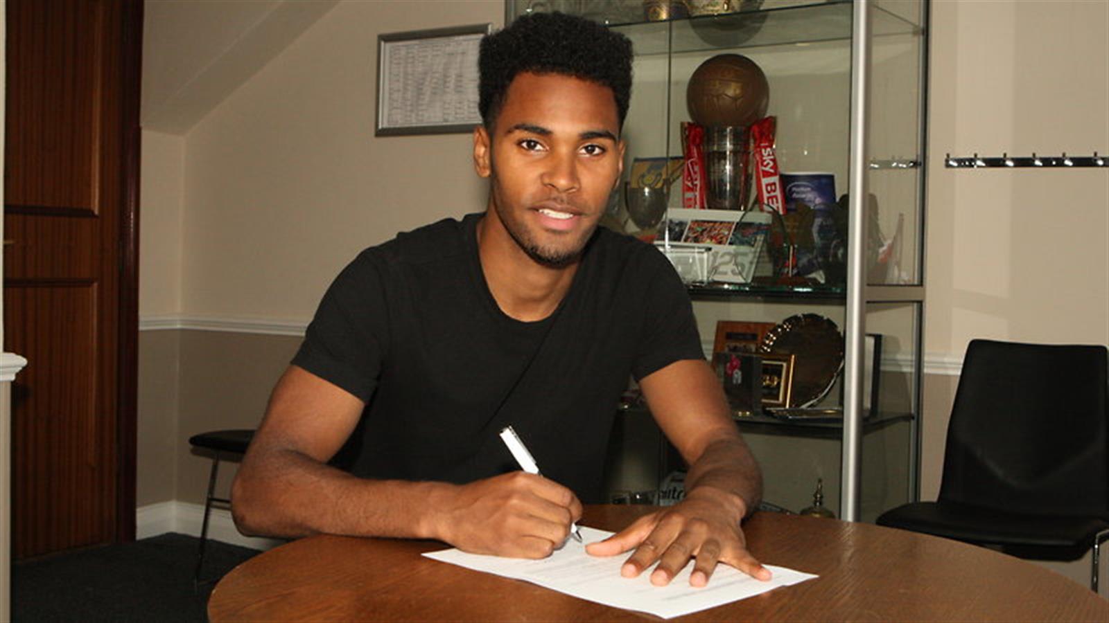 Rico Henry joins on a five-year deal from Walsall