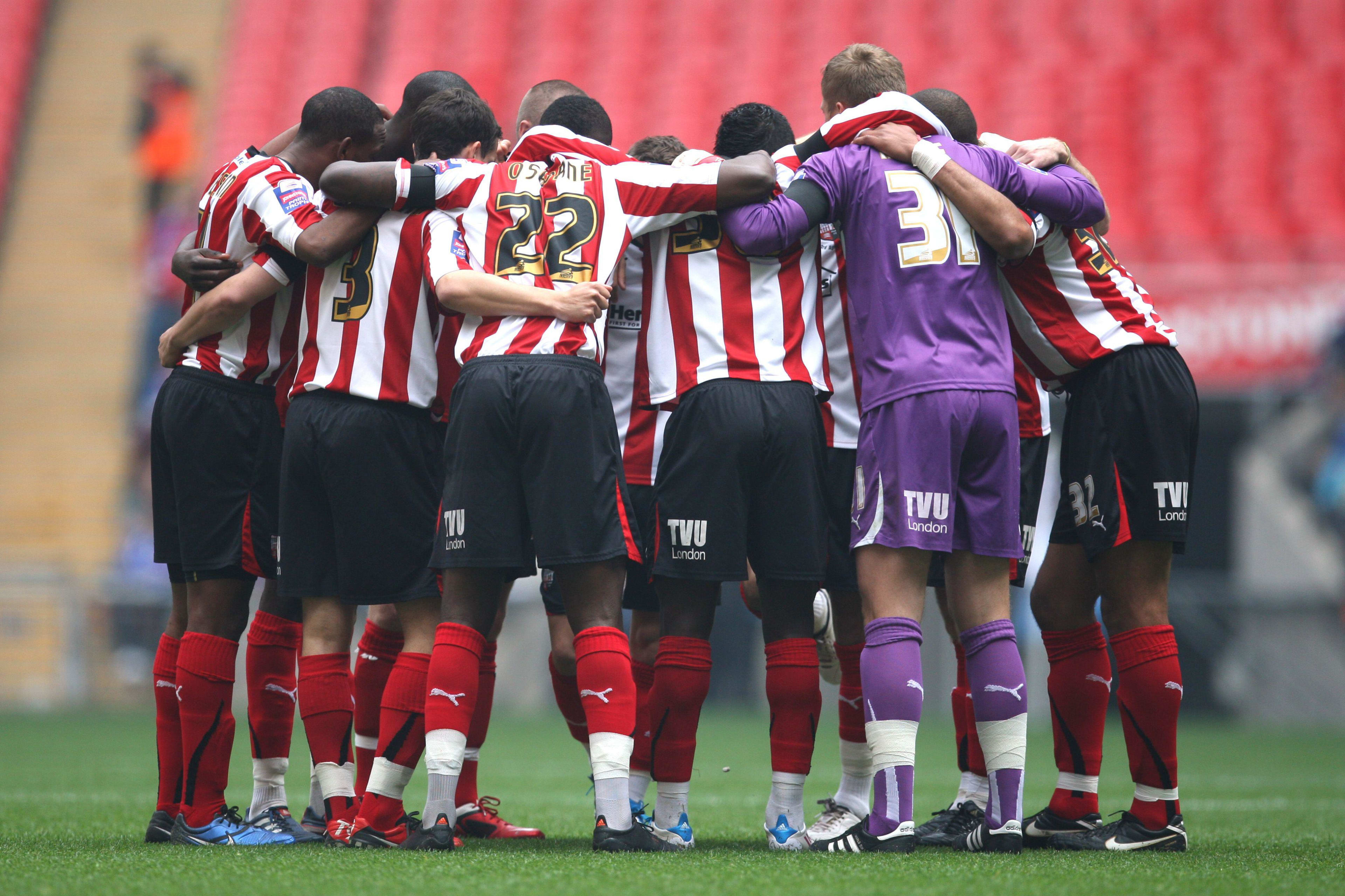 Brentford players in a huddle before the Johnstone's Paint Trophy Final at Wembley Stadium 3 April 2011