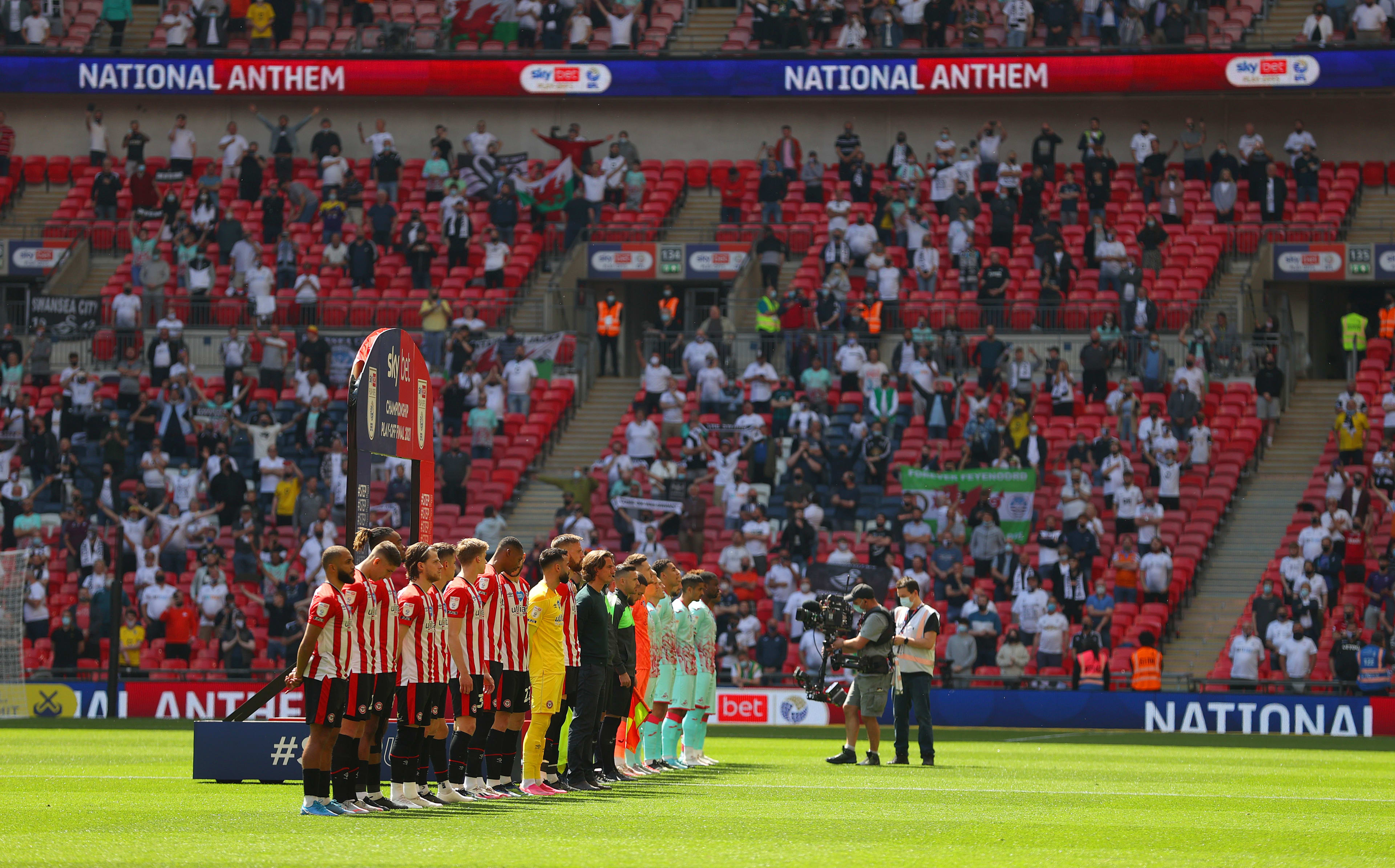 The Brentford FC squad line up for the national anthem at the Wembley Play Off final 2021/22