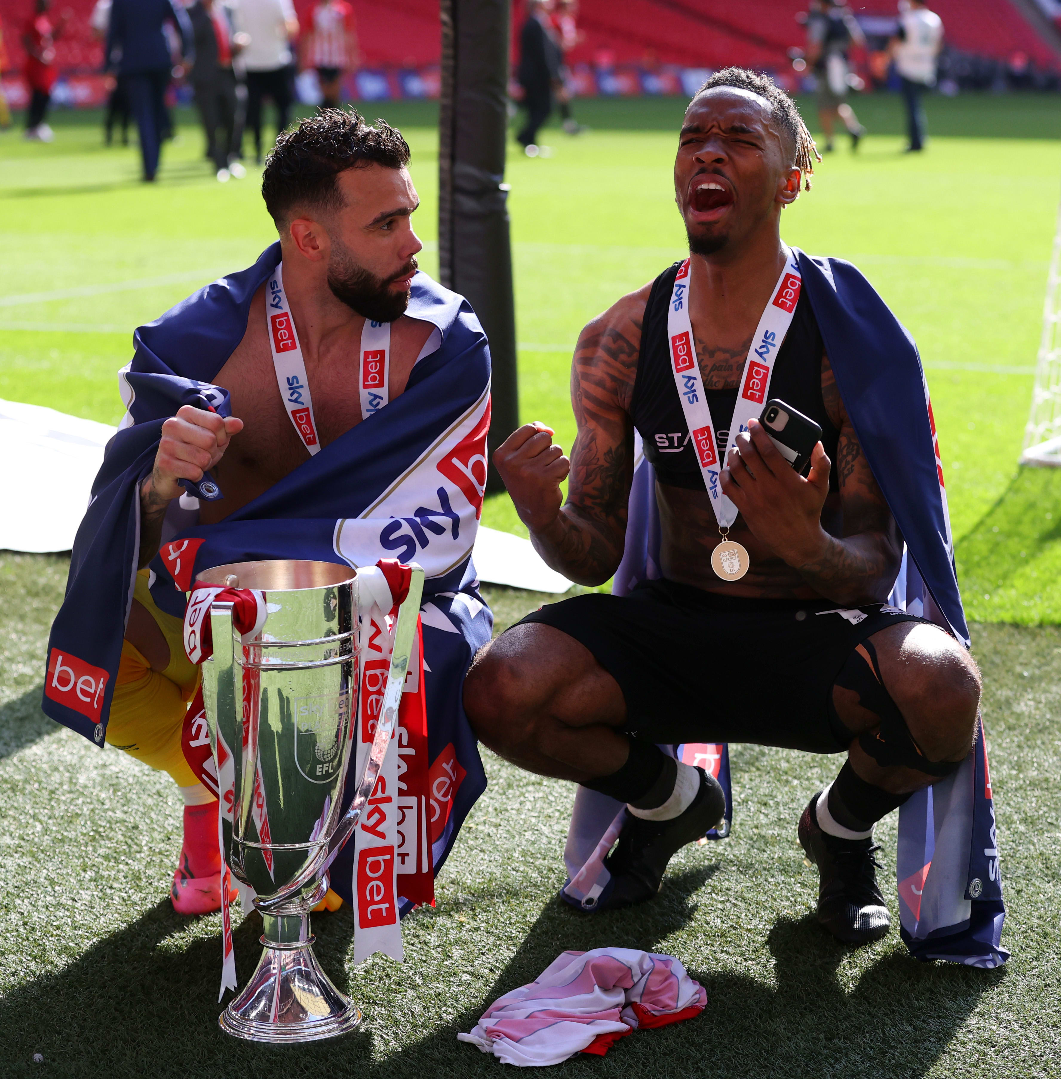 David Raya and Ivan Toney celebrate with the Play Off trophy at Wembley 