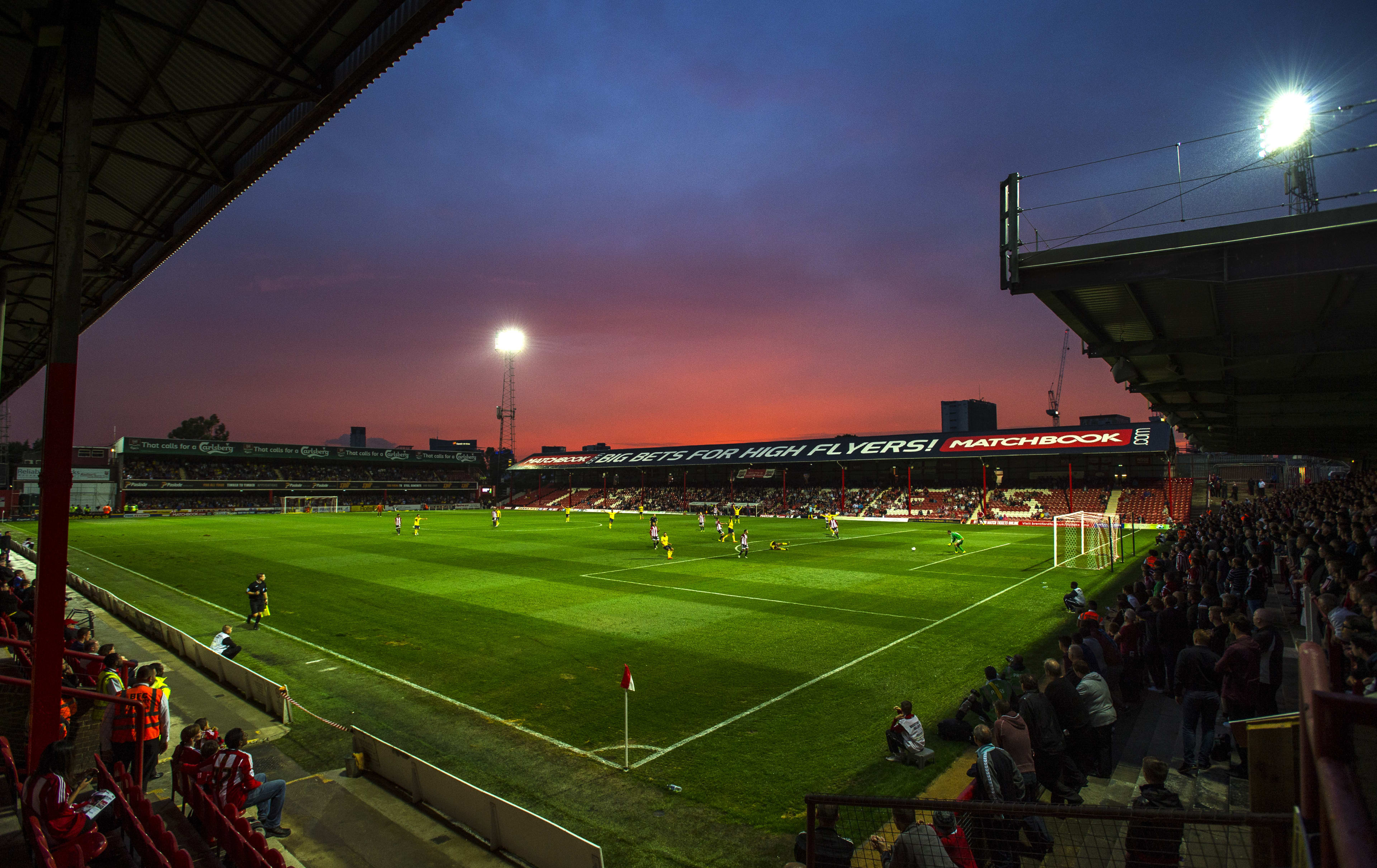 A view of the action at sunset during the Capital One Cup First Round at Griffin Park on 11 August 2015