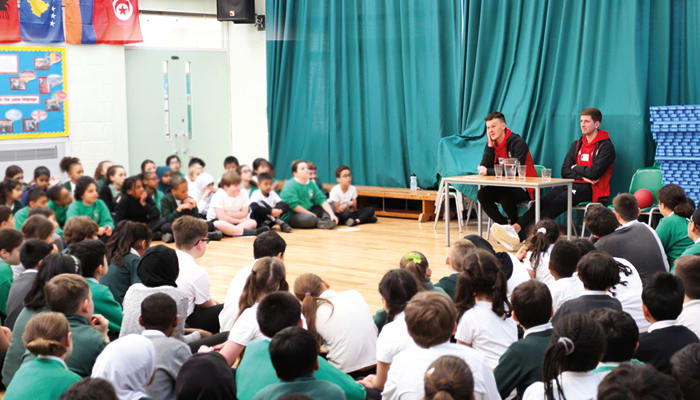 Brentford players quizzed by excited children at Primary School