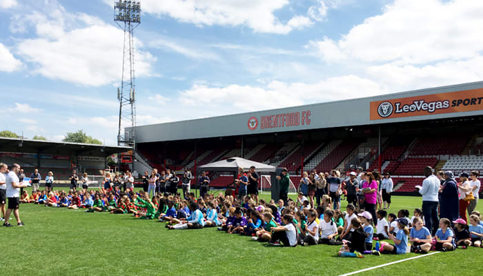 Girls play football on Griffin Park’s hallowed turf