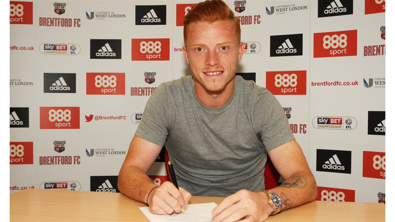 Ryan Woods signs new four-year deal at Griffin Park 
