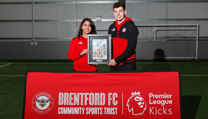 Young Brentford volunteer is awarded 'Kicks Hero' by the Premier League