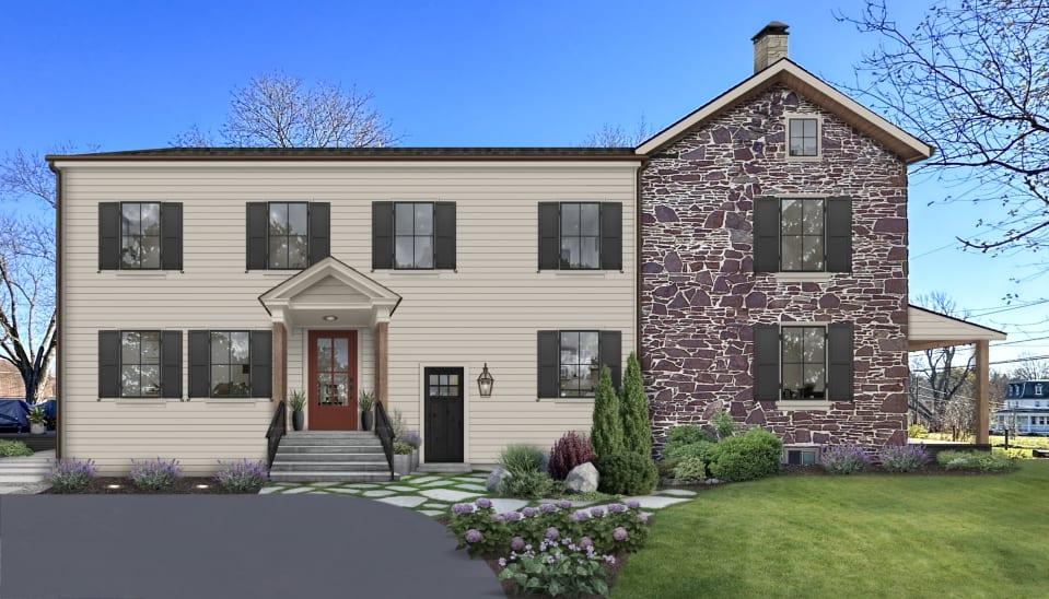 house with beige siding and cobblestone