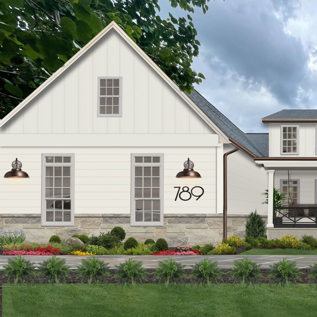 updated farm house painted in alabaster with large front porch and black and copper accents