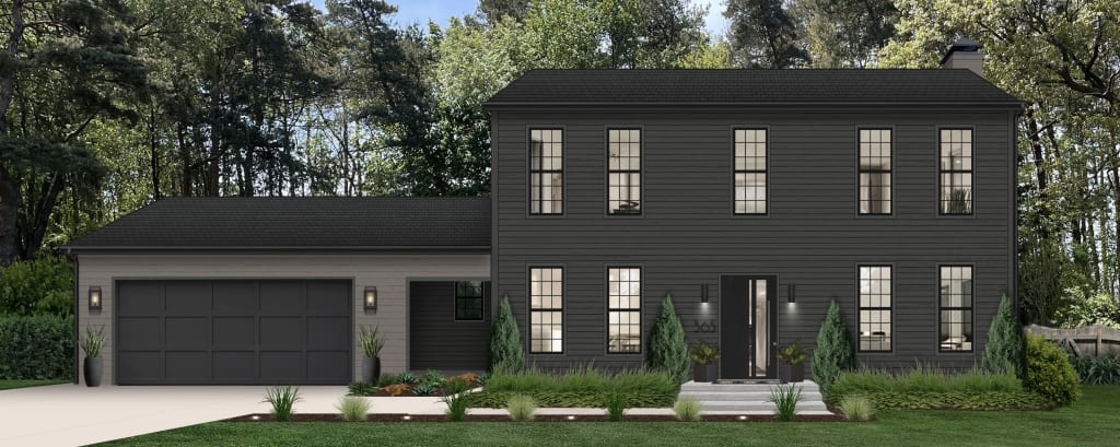 A large colonial home with black windows and garage doors, evergreen landscaping, and simple lighting.