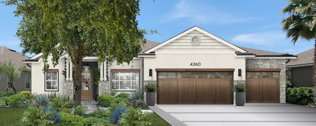 charming white house with wood garage doors, cultured stone, and a navy entryway