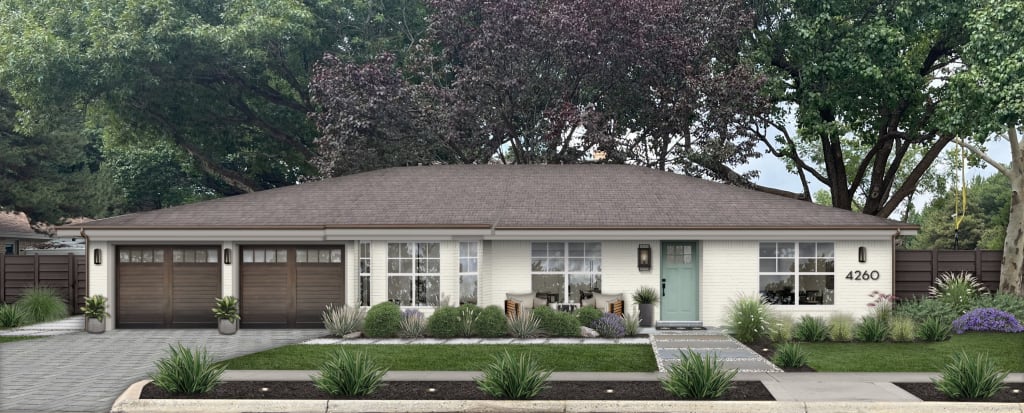 Brick rancher with wood look garage doors, a blue front door, copper gutters, and a stone and paver walkway.