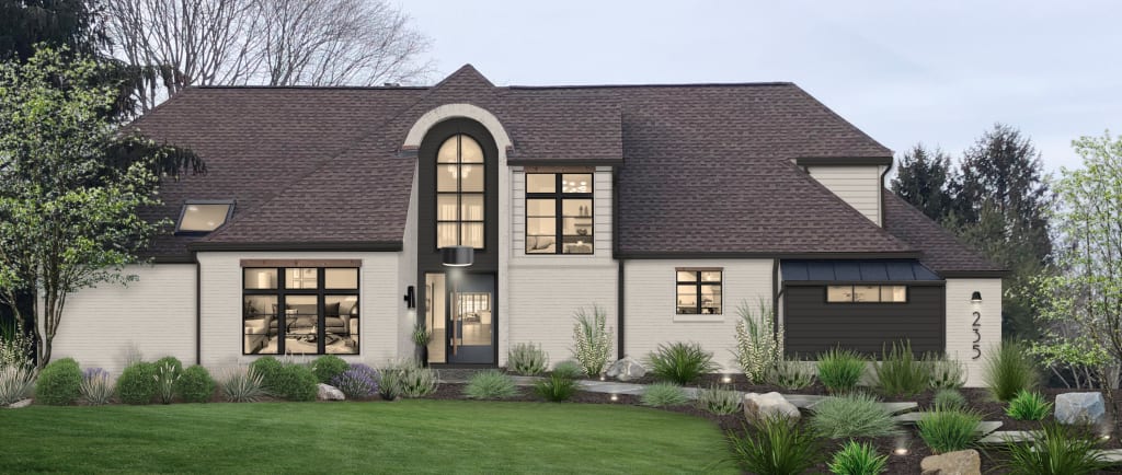 Traditional home with paver walkway and black modern windows