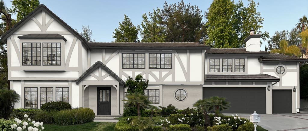 Tudor-style home exterior with white and gray paint.