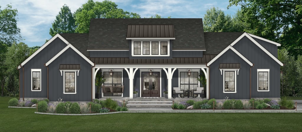 Navy farmhouse with white trim, metal awnings, white porch columns, and black windows.