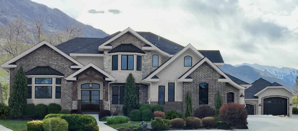 traditional home with brick and tan siding