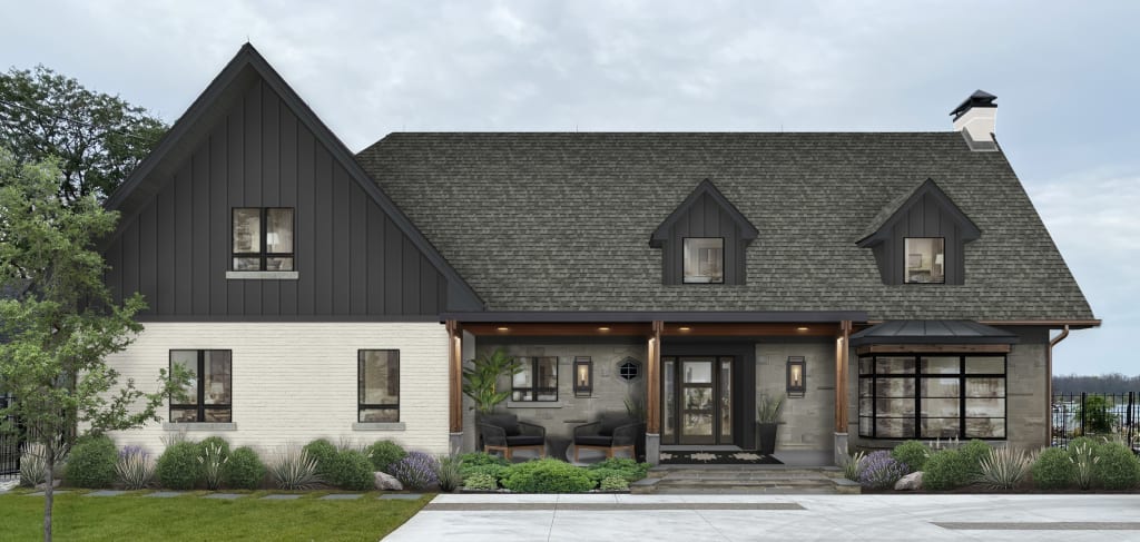 large home with light colored brick, gray stone, and charcoal siding