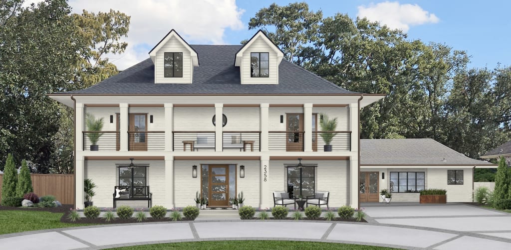 Two-story home with a large balcony, dormers, black cable railings, and black windows.