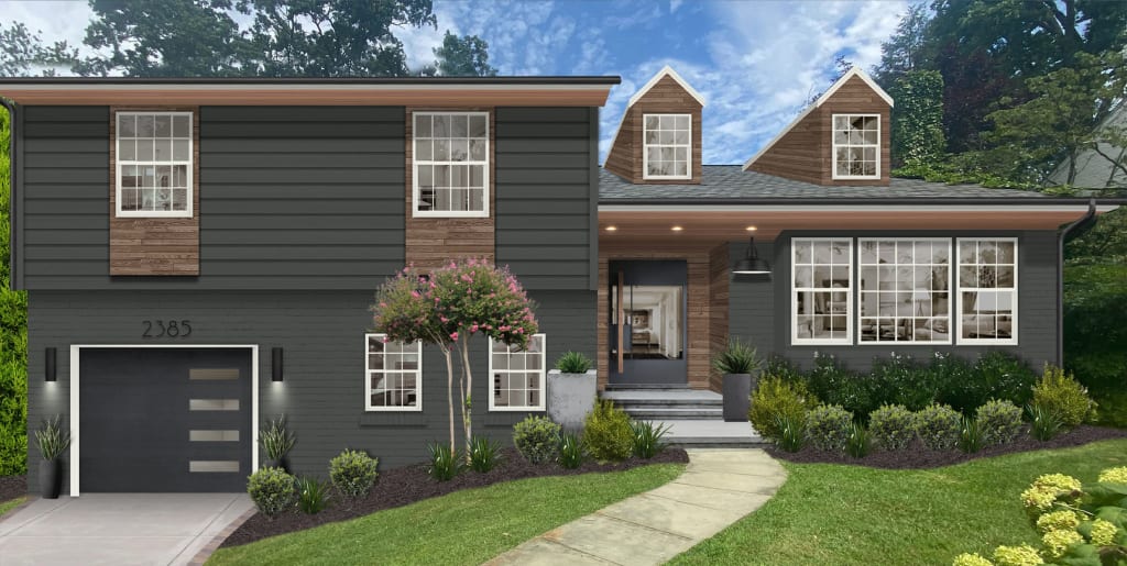 slate blue split level home with wood accents and black garage door