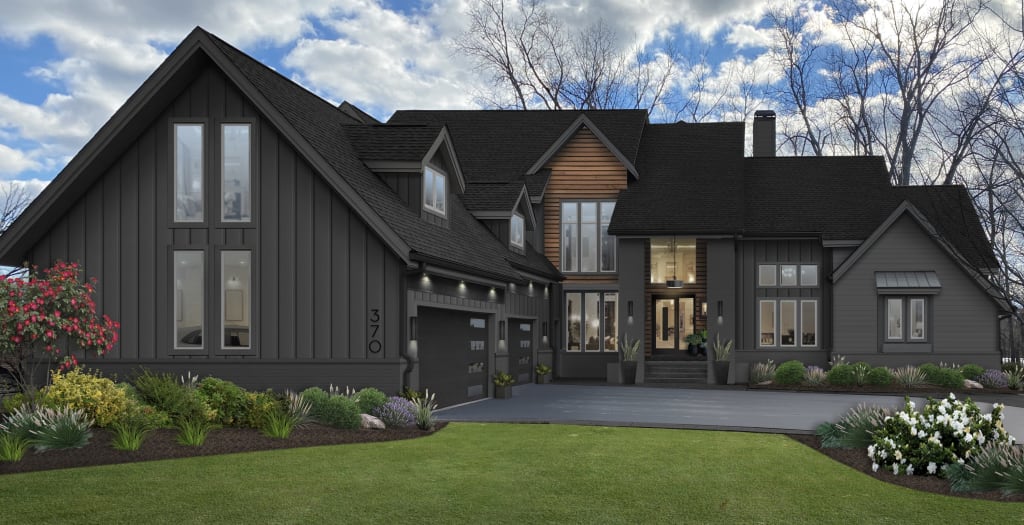 large home with charcoal siding and wood paneling accents