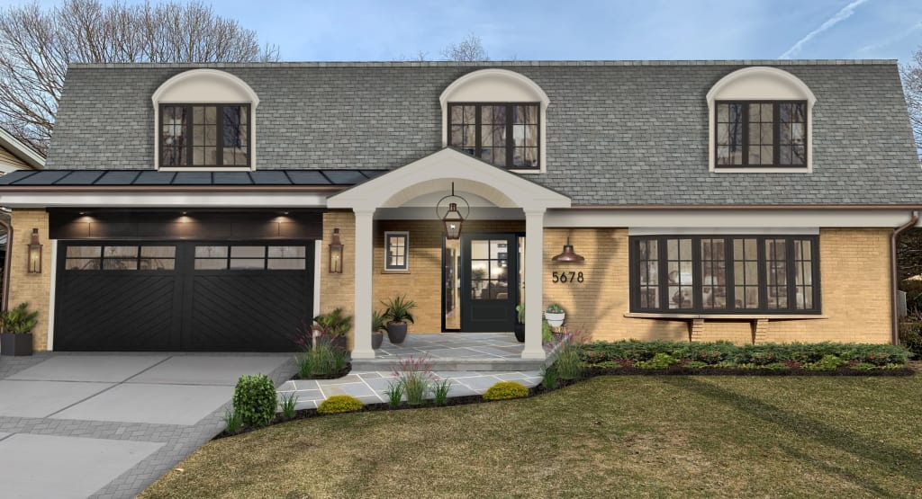 Brick home with a mansard roof and large dormers