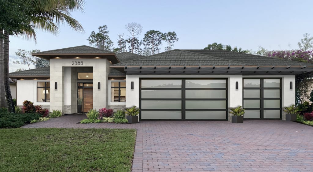 small ranch spanish style home with low pitch roof and glass paneled garage doors