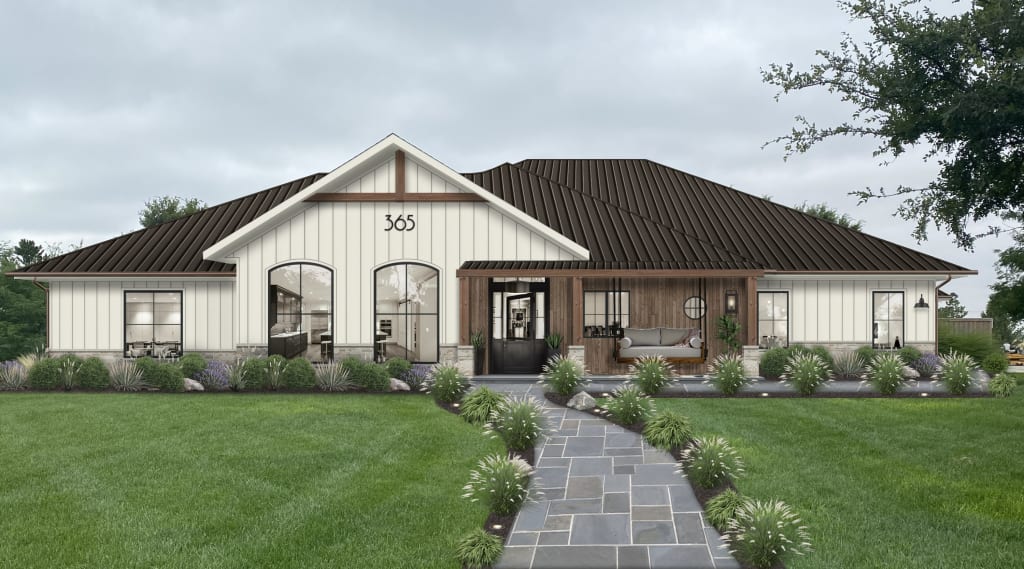 A white home with brown roof and accents