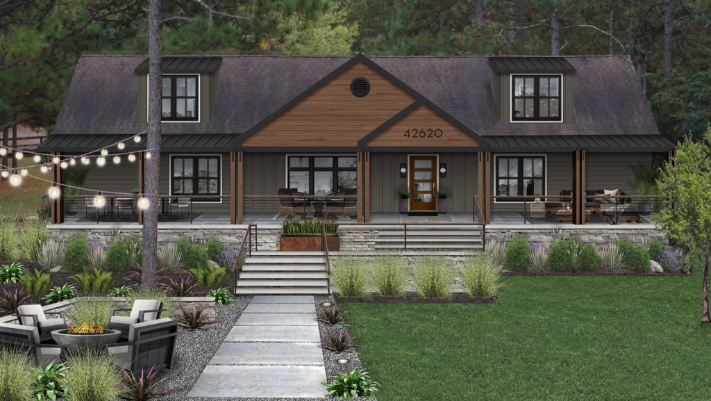 Cabin style home with a firepit in the front yard, string lights, and a stone and paver walkway.