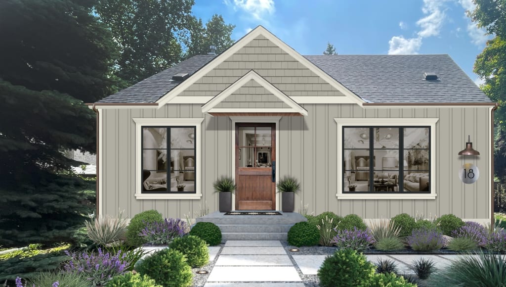 Small cottage with wood door, copper fixtures, and black windows.