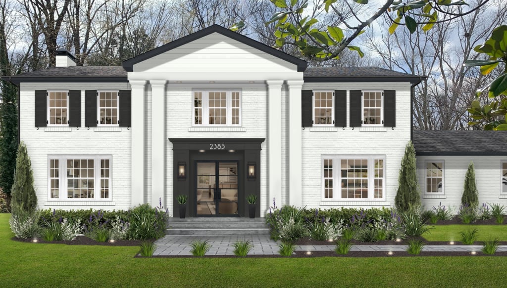 large white brick home with black shutters and accents