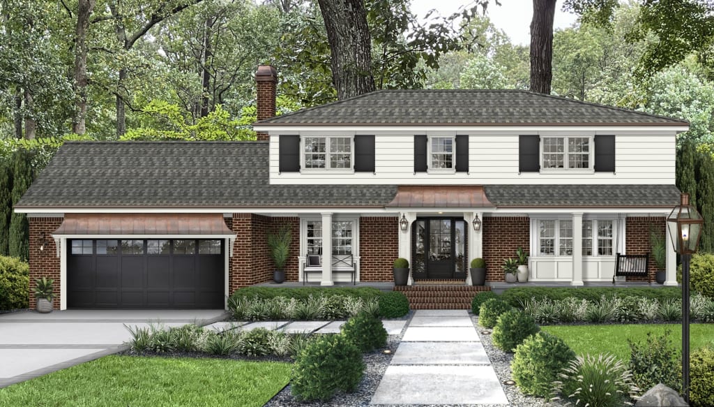 traditional home with white siding and red brick with copper awnings above the garage and front door