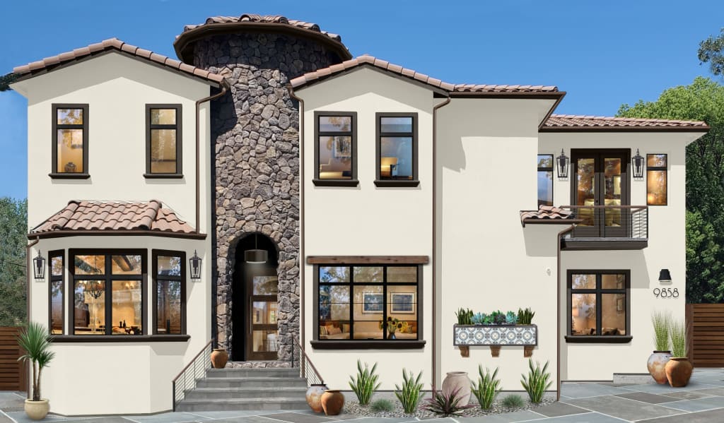 two story spanish style home exterior with center stone turret and large black frame windows