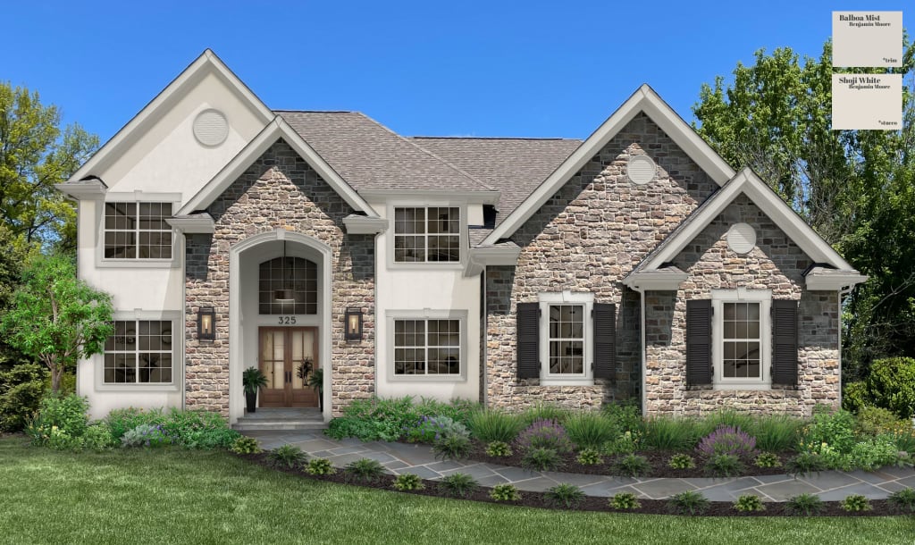 large traditional home with cultured stone and greige stucco