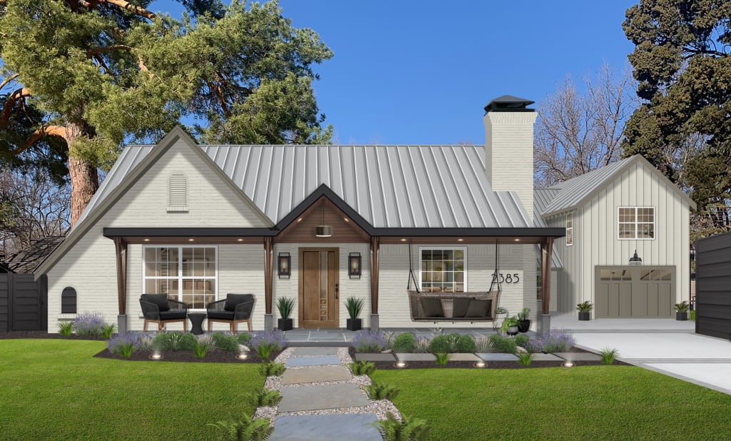 light greige farmhouse with brick and vertical lap siding, a large porch, sand and paver walkway, and wood accents