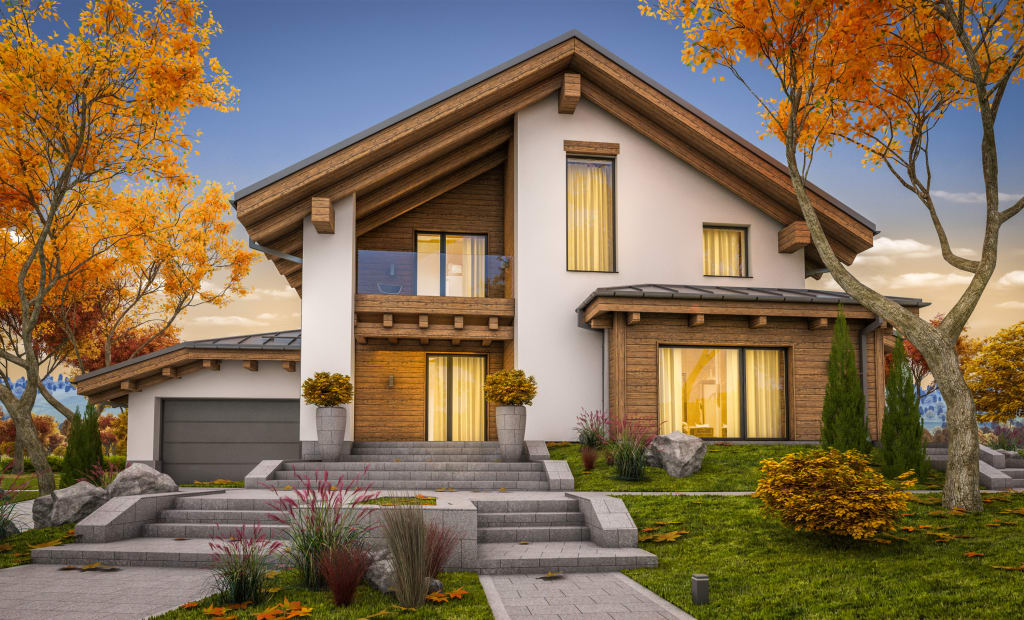 large home with Autumn-colored trees in the yard