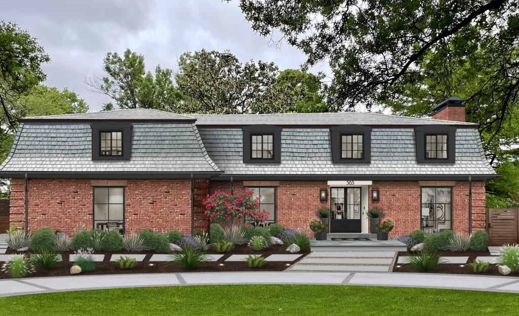 A red brick home with a mansard roof: front view